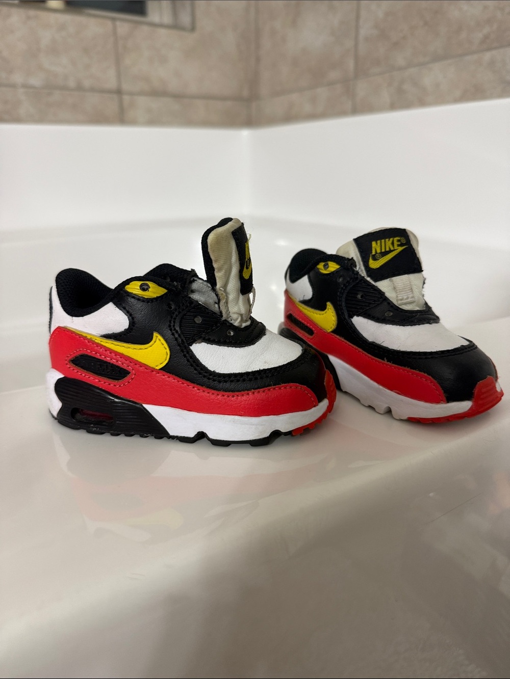Nike Kids Black White Red Sneakers with Yellow Swoosh